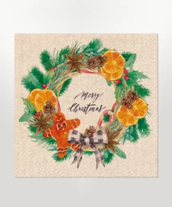 eco-friendly napkin lunch size featuring a merry christmas message and a christmas wreath filled with gingerbead men, oranges, cinnamon sticks, candy canes, pine cones and other festive items