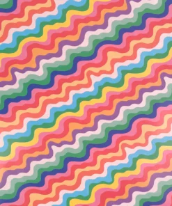 This vibrant image features a colourful, abstract squiggly pattern resembling wavy, zigzag lines in a variety of hues from the rainbow. The waves of colour create a lively, dynamic visual effect, with shades of pink, orange, yellow, green, blue, and purple intertwining and overlapping across the wrapping paper.