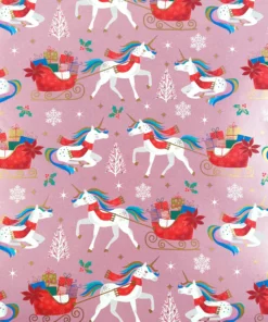 PRINTED GLOSS WRAPPING PAPER BELIEVE IN MAGIC. A fun kids Christmas wrapping paper featuring unicorns pulling Santa's sleigh, on a blushing pink background.