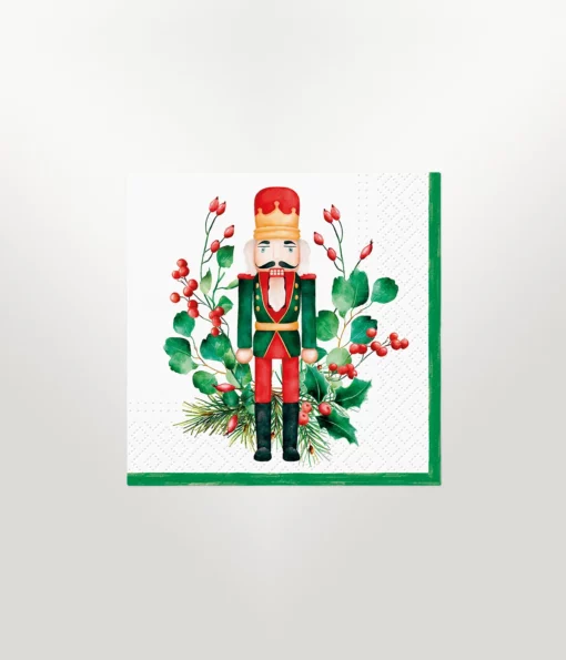 napkin cocktail size featuring christmas design of a nutcracker with flora on a white background