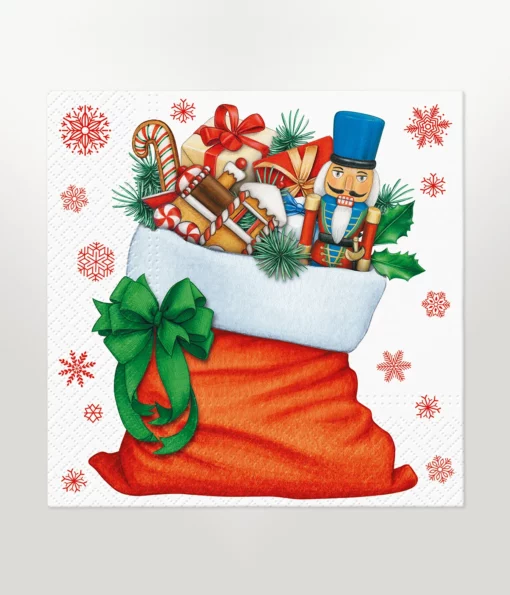 napkin lunch size featuring illustration design of a large christmas stocking filled with christmas items such as a nutcracker, pine needles, candy canes, and christmas presents on a white background